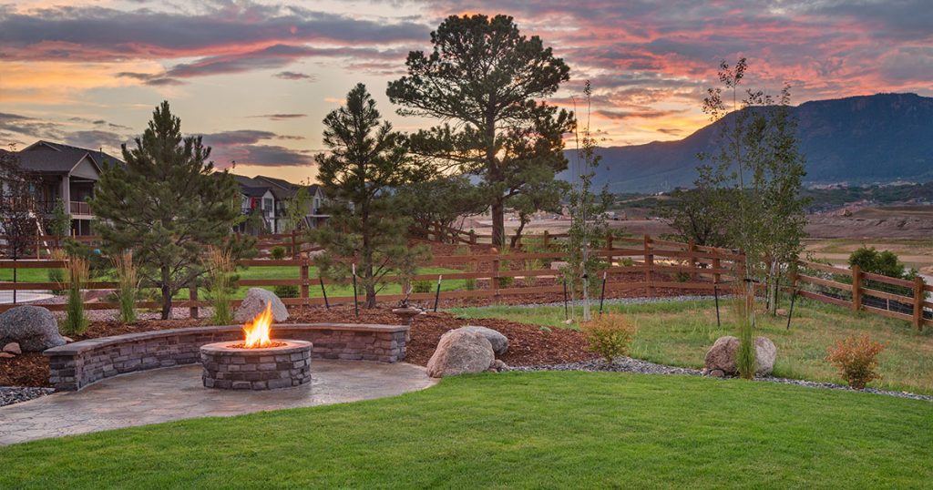 landscape with hardscaping and fireplace