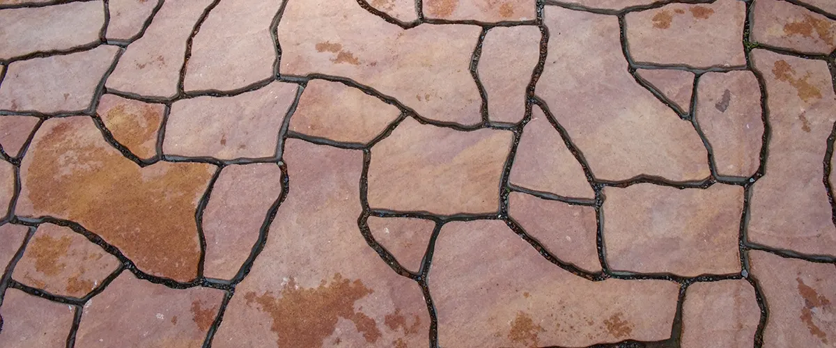 A flagstone patio with gaps in-between the stones