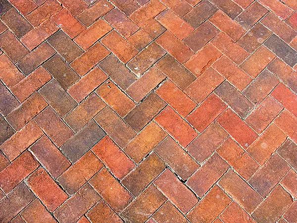A herringbone pattern with orange bricks