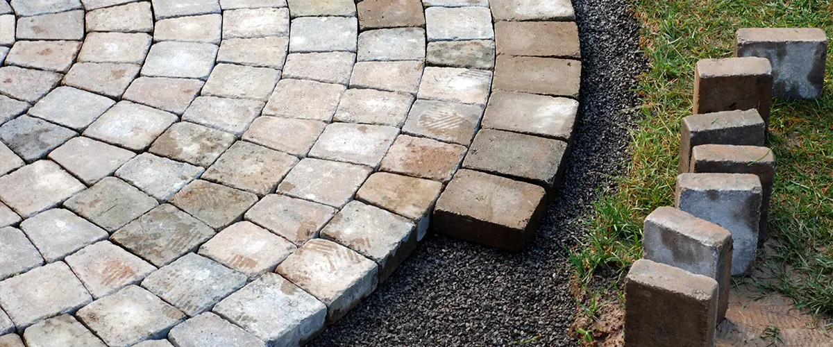 A patio with half bricks being installed