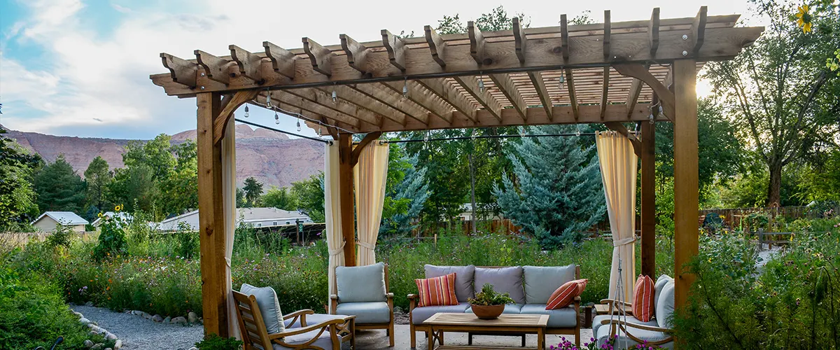 A pergola with a wood roof