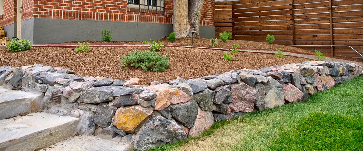 Stone retention wall in landscaping a backyard
