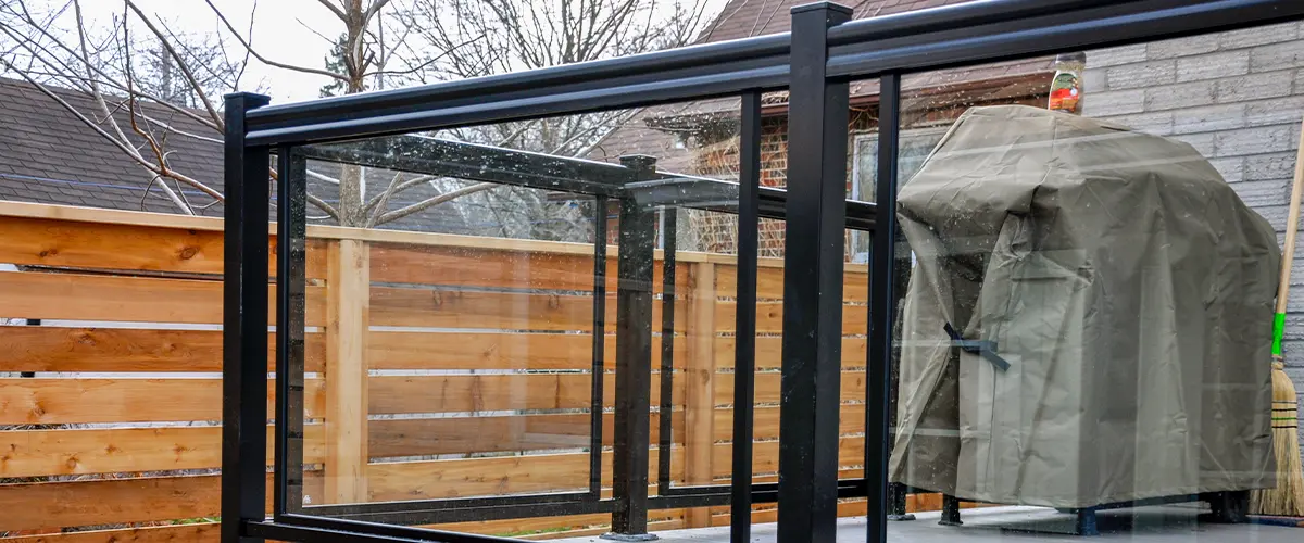 A metal rail with glass panels