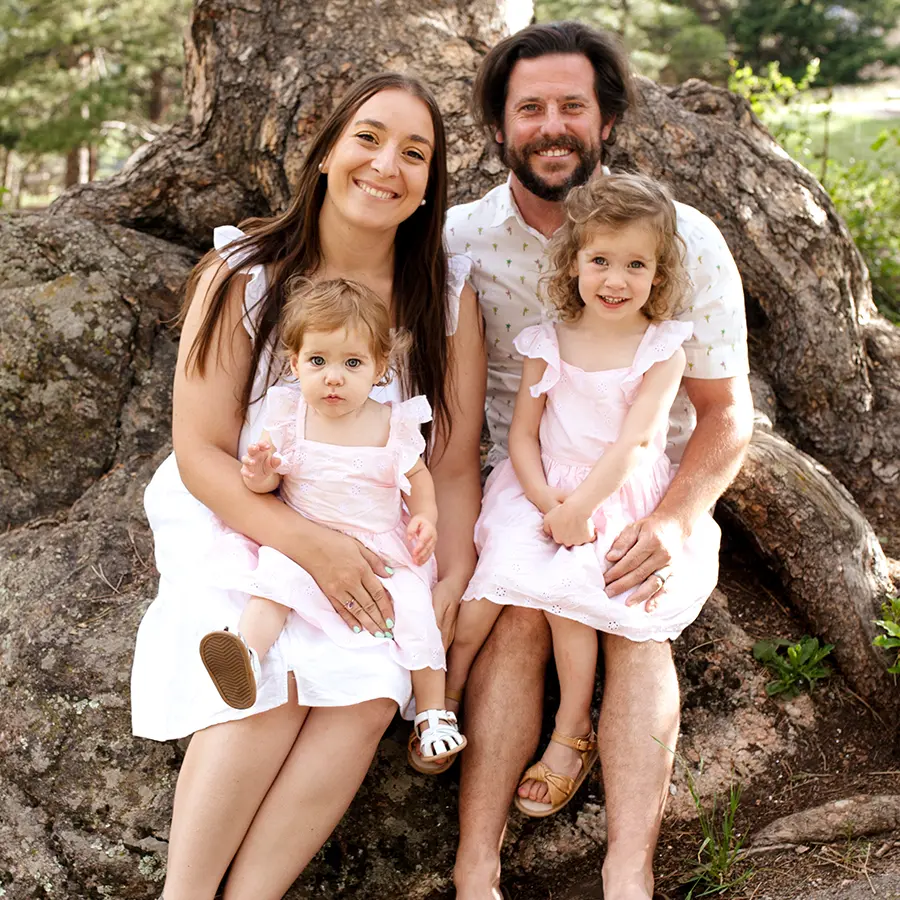 Family portrait of Colton Family, Jonathan, Flavia, and their two daughters