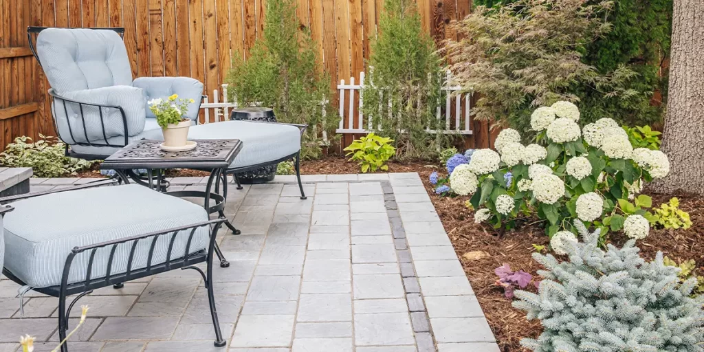 New patio with landscape with flowers and comfortable chairs