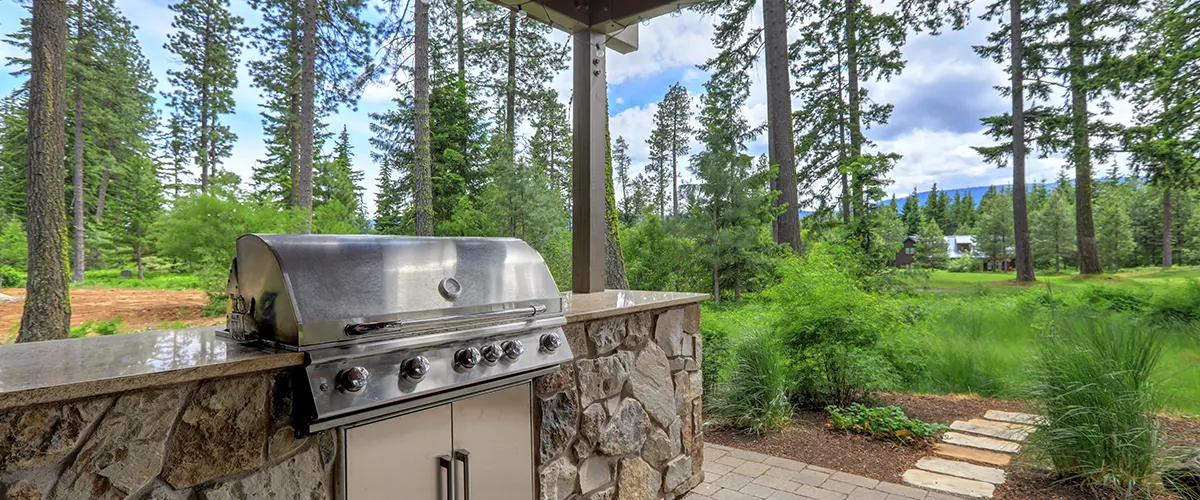 outdoor space with pavers and grill area