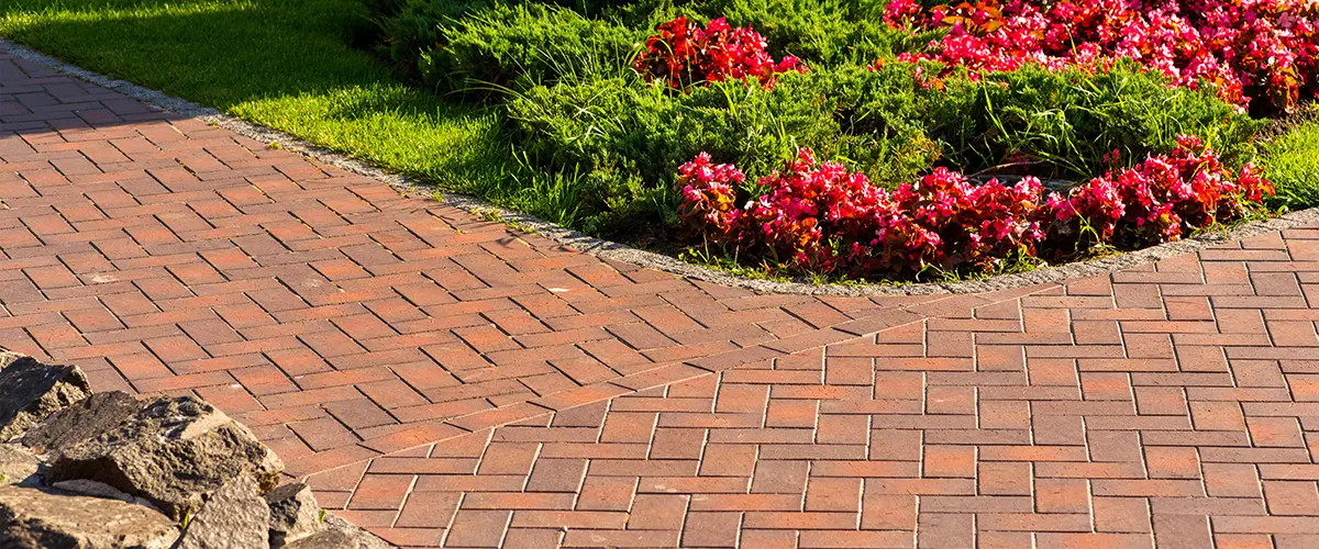 Brick patio and walkway with flowers