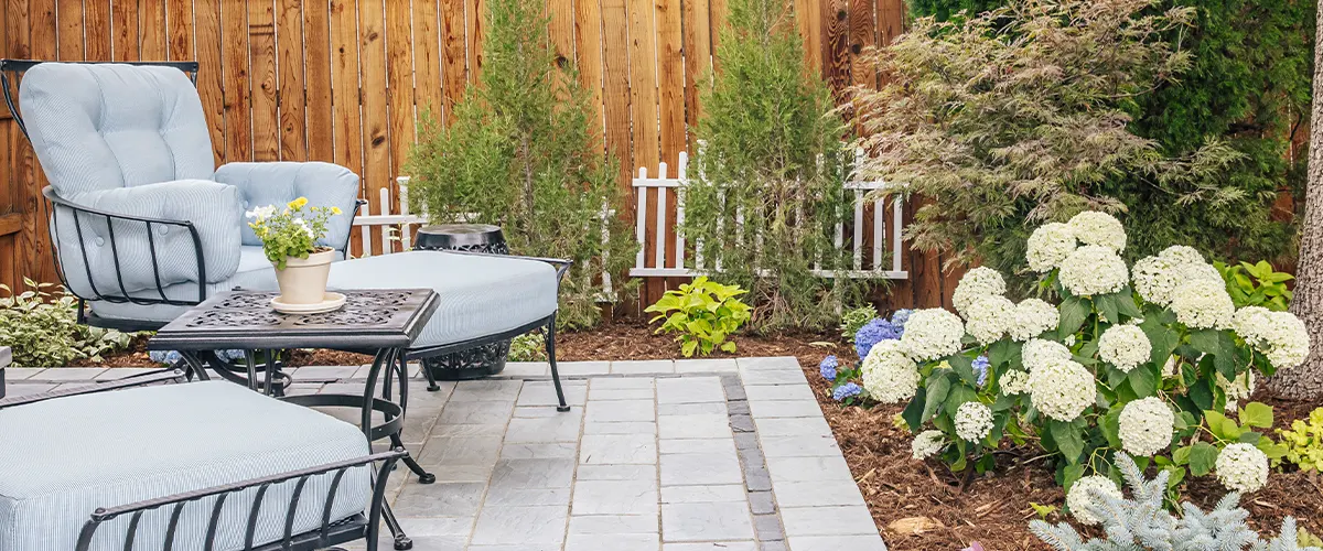 stone patio with fancy lounge chairs