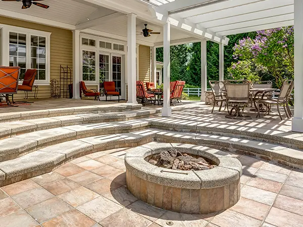 A paver patio with a fireplace