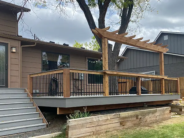 A deck with aluminum railing and a set of stairs