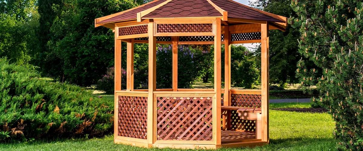 small wooden gazebo in park