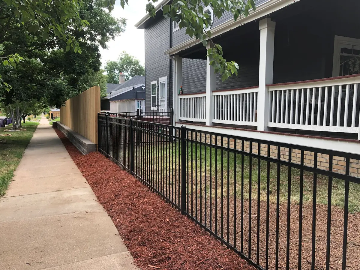 65 linear feet of metal fence, and 65 linear feet of retaining wall