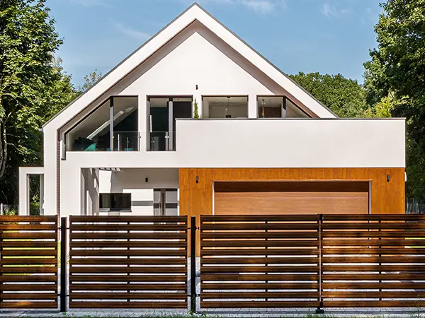 completed fence installation surrounding a modern home