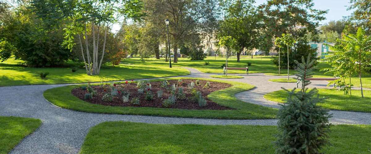 Well-maintained park with winding pathways and landscaped greenery.