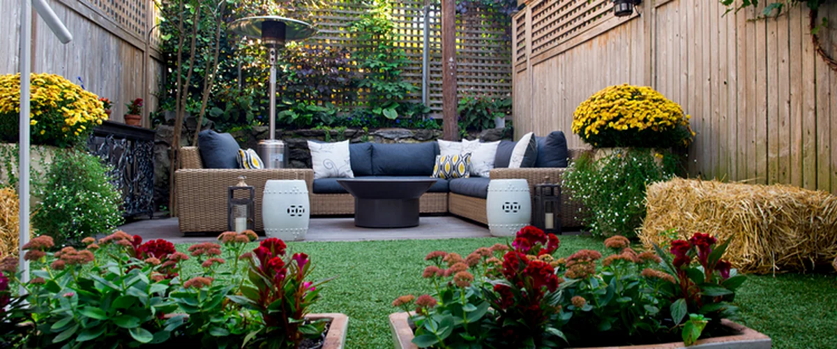 outdoor living space centennial co luxurious outdoor living space with rattan furniture vibrant flowers and wooden fencing