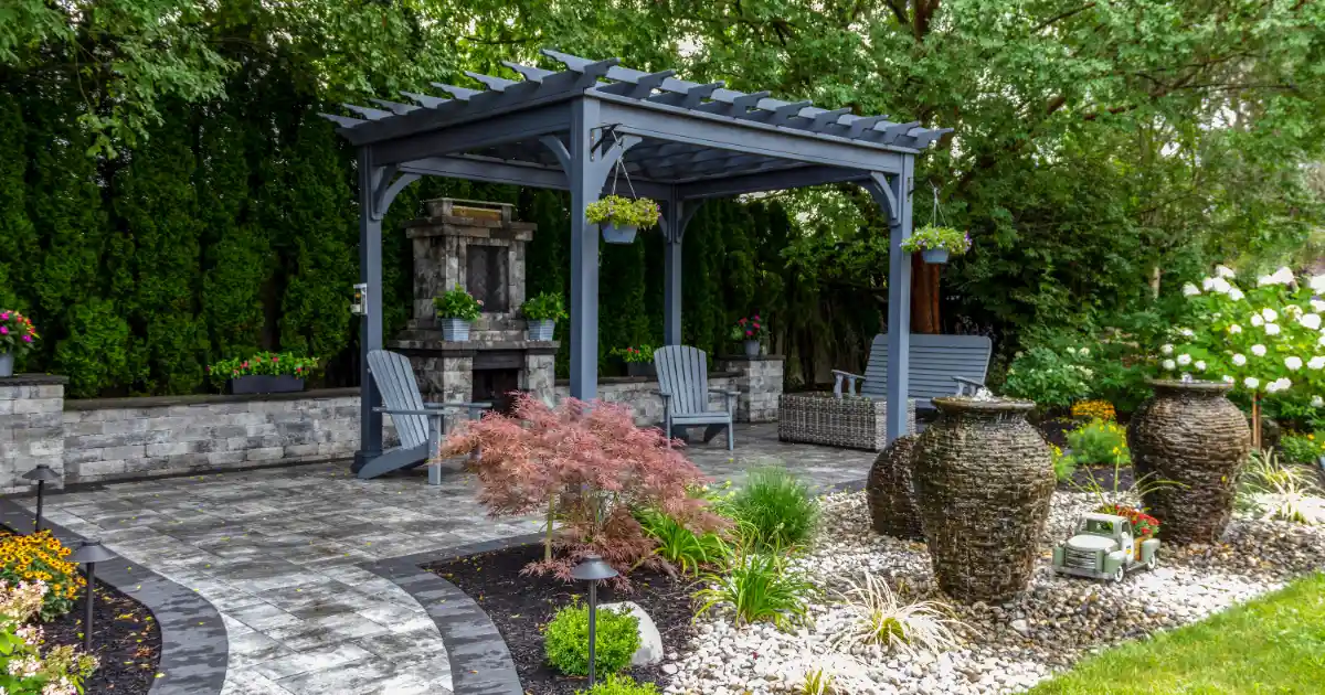 a freestanding pergola on a paver patio