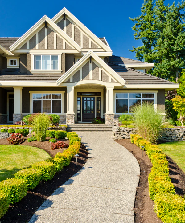 A luxury craftsman-style home featuring professional front yard curb appeal designed by landscape architect companies in Cherry Hills Village, CO.